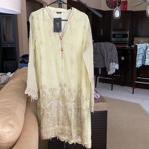 Lemon yellow organza kurta. Embroidery on the daman and sleeves